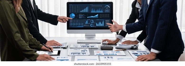 A business team reviews data dashboards to analyze intranet software pricing in 2026.
